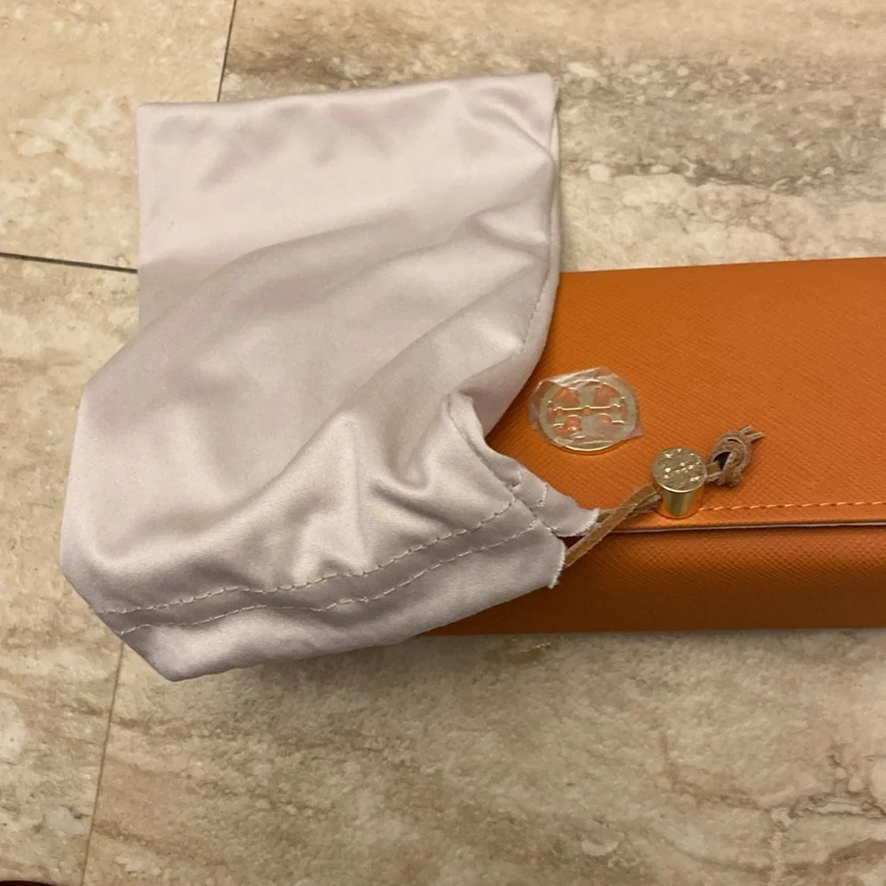 Tory Burch “Cranberry” sunglasses - New with case and dust bag.